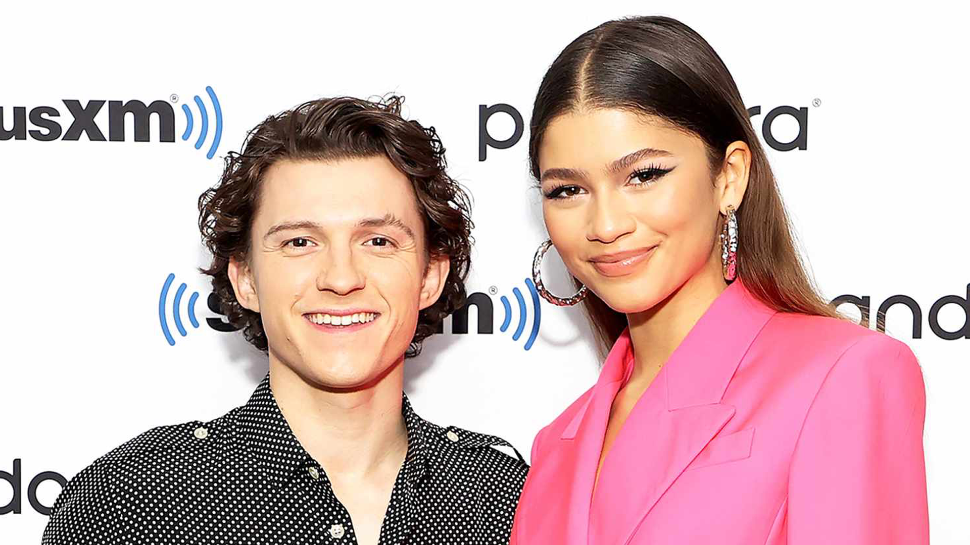 Picture of Tom and Zendaya in front of a siriusXM backdrop.